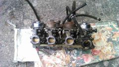 four carbs , freshly rescued from the bowels of satans bottom